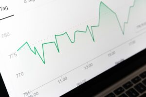 A white and green line graph showing generic analytics figures